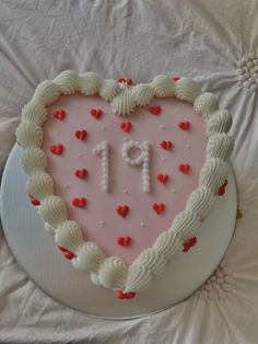 a heart shaped cake with the number 11 on it