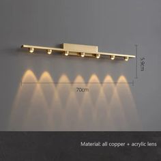 three lights are shown on the wall in front of a gray background with measurements for each light