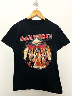 This tee shirt remains in pre owned condition. Measurements pit to pit: 18 inches  Top to bottom: 25 inches Graphic Tee T-shirt For Festivals With Crew Neck, Cotton Crew Neck T-shirt For Festivals, Festival Graphic Tee With Crew Neck, Heavy Metal Shirts, Vintage Metal Band Shirt, Iron Maiden Merch, Heavy Metal T Shirt, Band Tee Shirts, Vintage Iron Maiden Shirt