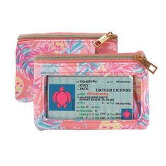 two pink and blue purses with an id card in the front one has a turtle on it