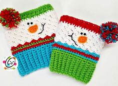 two knitted mittens with snowmen on them