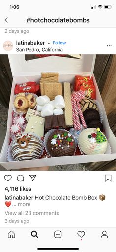 an open box filled with lots of different types of chocolates and candies on top of each other