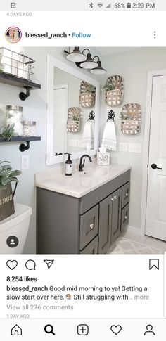 a bathroom with two sinks and mirrors on the wall next to a toilet in front of a mirror