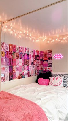 a bedroom with pink and white decor on the walls, lights strung from the ceiling