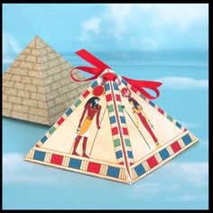 two egyptian pyramids with red ribbons tied around them