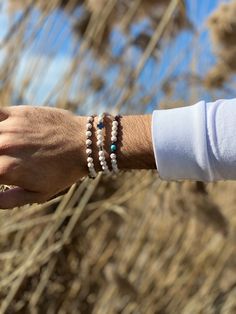 Three different Handmade Men's Bracelets with white lava beads in special designs. In Christina Christi Jewels store you can see more than 100 designs in Men's Bracelets. You can also find these bracelets in black and purple color in my store. Read the description below. You can have them in 2-4 Days with DHL EXPRESS SHIPPING MATERIALS - Metal Beads - Lava Beads (6mm). - Metal cross. - Turquoise Bead (6mm) . - Metal Parts. - Elastic cord. DIMENSIONS - You can choose four different dimensions for Spiritual White Friendship Bracelets For Everyday, Everyday Spiritual White Friendship Bracelets, White Spiritual Hand-strung Friendship Bracelets, Casual White Bracelet With Natural Stones, Casual White Bracelets With Natural Stones, White Hand-strung Braided Beaded Bracelets, Casual White Beaded Bracelets With Natural Stones, Everyday White Gemstone Beads Bracelets, Casual White Hand-strung Wristband