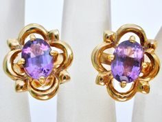 Gemstone Jewellery - This is a pair of 18K yellow gold pierced post earrings with amethyst gems. Each earring measures slightly over .5" by .5", and hosts 1.25 carats of amethyst, for a total weight of 2.5 carats. The earrings weigh 6.2 grams, backs are hallmarked 750 for 18K gold, the earrings test for 18k with acid test. I am selling these earrings and an amethyst necklace for Baby Lennon and all proceeds will go to her. If you would like to read Lennon's story, click here: https://thejewelryl Formal Purple Clip-on Jewelry, Purple Clip-on Earrings For Formal Occasions, Yellow Gold Earrings, Amethyst Gem, Gemstone Jewellery, Purple Stones, Amethyst Necklace, Yellow Gold Earring, Amethyst Earrings