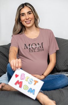 Custom MOM Tee! Wear your heart on your sleeve and showcase your love for your child(ren). Enter the details within the personalization section to customize with your child's name and the year you became a mother. If there is another size or color you are interested in, please contact me. Wash/Dry Information: Inside Out Cold Hang Dry Preferred (Tumble Dry Option) Family Matching Short Sleeve T-shirt For Personalized Gift, Personalized Mother's Day T-shirt With Custom Text, Mother's Day Personalized Name Print T-shirt, Custom Text T-shirt For Mother's Day Personalized Gift, Custom Text T-shirt For Mother's Day Gift, Personalized Name Print T-shirt For Mother's Day, Family Matching T-shirt With Custom Text For Personalized Gift, Family Matching Custom Text T-shirt For Personalized Gift, Personalized Family Matching T-shirt With Custom Text