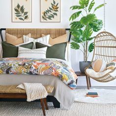 a bed room with a neatly made bed and hanging plants