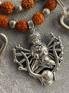 Amazing necklace with Goddess Kali 🙏🏻 The basis of the necklace is rudraksha with metal oriental elements and trisula - an attribute of God Shiva. The necklace is easily adjustable with a string. Maximum length 64 cm, Kali 4 cm x 8 cm.  Earrings - trisula length 6 cm, width 2.5 cm. Symbolic Necklaces For Meditation And Festivals, Handmade Spiritual Necklaces For Puja, Spiritual Oxidized Temple Necklace, Handmade Spiritual Necklace For Navratri, Spiritual Necklaces For Navratri Gift, Spiritual Oxidized Temple Necklace As Gift, Pendant Necklace For Puja And Navratri, Spiritual Oxidized Finish Temple Necklace As Gift, Spiritual Necklaces For Meditation And Navratri