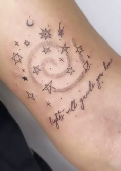 a woman's arm with stars and a spiral tattoo on it that says, night is all you need