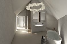 a bathroom with a white bath tub sitting next to a sink under a light fixture