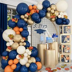 an arch made out of balloons and other decorations