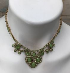 "Green rhinestones, prong set necklace with large prong set opaque stones in a gold tone metal statement Piece.  15\" long (choker, with about a 1.25\" center drop Date/ Time Period: Circa Late 1900's Condition: Good" Crystal Necklaces, Set Necklace, Cubic Zirconia Rings, Pink Turquoise, Rhinestone Necklace, Gorgeous Necklaces, Gold Tone Metal, Crystal Necklace, Prong Setting