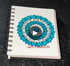 a spiral notebook with the title jal's creations on it