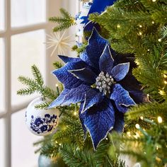 a christmas tree with blue and white decorations