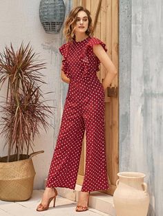 This burgundy Ruffle Armhole Polka Dot Palazzo Jumpsuit is the perfect addition to any boho wardrobe. With ruffle detailing and a high waistline, it boasts a regular fit with a sleeveless, round neckline. It has a wide leg, zipper closure, and long length, is made from non-stretch fabric, and is unlined. Specifications: Color: Burgundy Style: Boho Pattern Type: Polka Dot Type: Wide Leg Details: Ruffle, Zipper Length: Long Fit Type: Regular Fit Neckline: Round Neck Sleeve Length: Sleeveless Waist Designer Overalls, Palazzo Jumpsuit, Comfy Jumpsuits, Burgundy Style, Designer Jumpsuits, Chic Bohemian, Jumpsuit Elegant, Jumpsuit Outfit, Leg Design