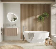 a white bath tub sitting next to a window