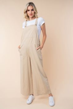 A Sleeveless Wide Leg Jumpsuit is a chic and versatile one-piece garment that features a sleeveless top with wide-leg pants. This style combines the comfort of a jumpsuit with the trendy silhouette of wide-leg pants, creating a stylish and effortless outfit option. The sleeveless design is perfect for warm weather or layering with a jacket or cardigan for cooler days. The wide-leg pants add a touch of sophistication and elegance to the overall look, making it a versatile piece that can be dresse Cute Jumpsuits For Women, Cream Jumpsuit Outfit, Stylish Jumpsuits For Women, Textiles Clothing, Effortless Outfit, Clothing Designs, White Birch, White Jumpsuit, Short Leggings