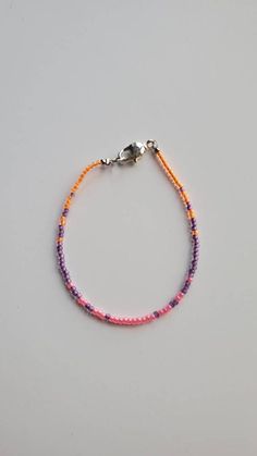 "More styles and colors here: https://www.etsy.com/shop/MeadowValleyDesignCo Please be sure to measure your ankle and select your size at checkout. Comes with a 1\" extender chain. This anklet is made with hot pink, wisteria and neon orange. It is finished with a silver color lobster claw clasp." Pink Seed Bead Bracelet, Pink Wisteria, Seed Bead Anklet, Bracelet Business, Tiny Bead Bracelet, Womens Ankle Bracelets, Aesthetic Jewellery, Manik Manik, Bead Anklet