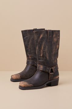 Give any of your 'fits an exceptionally edgy upgrade with the addition of the Steve Madden Rhoda Brown Distressed Leather Mid-Calf Moto Boots! These too-cool boots have a smooth, distressed genuine leather construction that shapes a chic square-toe upper and a 11"" mid-calf shaft with a 14.5"" circumference and pull tabs at either side of the collar. Classic, matching O-rings at the outstep and instep complete the moto-inspired look! 2" block heel. Lightly cushioned insole. Nonskid rubber sole. Genuine Leather Upper. Man Made Materials. Imported. Lulus | Rhoda Brown Distressed Leather Mid-Calf Moto High Heel Boots | Size 7.5. Fall Moto Boots With Reinforced Toe In Oiled Leather, Rustic Moto Boots With Reinforced Toe For Fall, Rustic Reinforced Toe Moto Boots For Fall, Rugged Leather Moto Boots With Wide Calf, Rugged Oiled Leather Moto Boots With Reinforced Heel, Rugged Moto Boots With Reinforced Heel, Rugged Moto Boots With Square Toe And Leather Sole, Rustic Leather Moto Boots With Reinforced Heel, Rugged Moto Boots With Leather Sole