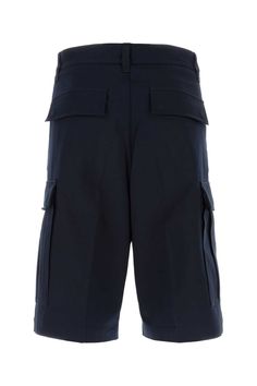 Midnight Blue Cotton Bermuda Shorts from Ami Alexandre Mattiussi Navy Cargo Bottoms For Workwear, Bermuda Workwear Pants With Pockets, Bermuda Workwear Bottoms With Pockets, Navy Trousers With Side Pockets, Blue Short Leg Pants With Pockets, Blue Pants With Pockets And Short Legs, Navy Workwear Shorts With Pockets, Blue Bermuda Pants With Pockets, Blue Workwear Shorts With Pockets