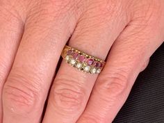 VICTORIAN ANTIQUE Genuine Almandine Garnet and pearl Filigree Ring Circa 1897 Size 8.75 and sizable by a skilled jeweler to keep the design that goes around the shank Hallmarks inside + 12 and tested for 12k 6 pearls all appear original approx. 2 - 2.8mm 6 BEAUTIFUL raspberry colored garnets 2.9- 3.3mm square shaped all appear original  See photos...there is a faint line on both sides of the shank where a past resizing occured GARNET is a stone of regeneration and energizing it can boost energy. Victorian Style Red 14k Gold Ring, Victorian Oval Garnet Ruby Ring, Red Victorian Filigree Ring With Gemstone, Victorian Garnet Gemstone Rings, Victorian Multi-stone Ruby Ring In Gold, Garnet And Pearl, Almandine Garnet, Raspberry Color, Antique Boxes