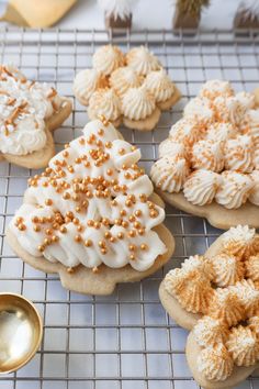 several decorated cookies sitting on top of a cooling rack