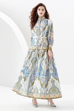 This blue paisley maxi dress from You Spin Me Around is perfect for party or festive occasions. It features a stand collar with puff long sleeves and a flowy silhouette for a timeless look. Its vintage-inspired pattern is sure to make you stand out in any crowd. SIZE GUIDE (CM) Size Bust Waist Sleeve Shoulder Length S 106 110 59 36 135 M 110 114 60 37 136 L 114 118 65 38 137 XL 118 122 66 39 138 XXL 122 126 67 40 139 Vintage French Dress, Barbie Bride, Fall Vintage, French Dress, Paisley Maxi Dress, Puff Long Sleeves, Flowy Maxi Dress, Bride Style, Long Sleeve Maxi