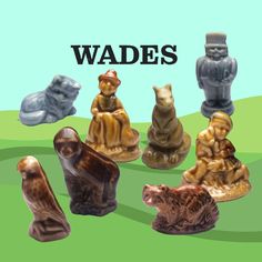 a group of ceramic figurines sitting on top of a green field