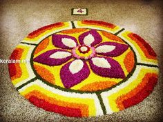 a colorful flower design on the ground