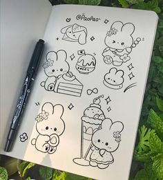 an open notebook with some drawings on it