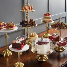 an assortment of cakes and pastries on display