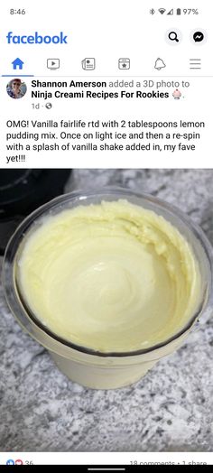 a bowl filled with yellow cream sitting on top of a counter