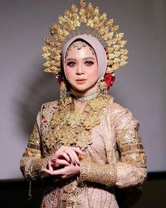 a woman dressed in an elaborately designed outfit