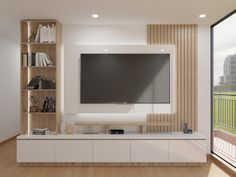 a large flat screen tv mounted to the side of a wall in a living room