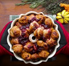 a pie filled with cranberry sauce sitting on top of a table