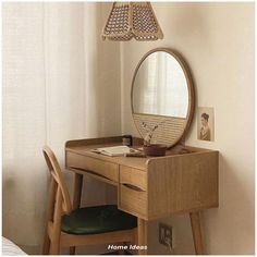 a wooden desk with a mirror and chair