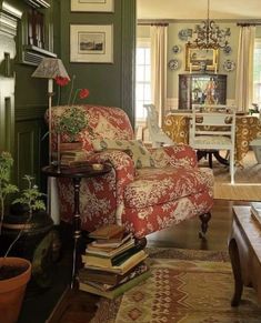 a living room filled with furniture and lots of books on top of a coffee table