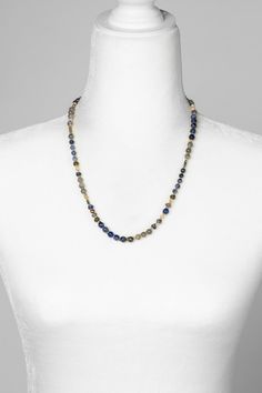 Discover the vibrant and stunning colors of the Blue Moon Collection in this eclectic necklace! Gold Filled (Lead & Nickel Free) Pyrite, Lapis Lazuli, Sodalite, Mother Of Pearl, Labradorite 20.5-22.5" adjustable length, with gold filled lobster claw clasp We hand select our natural materials, thus there may be slight variations in color and/or size that will not detract from the overall aesthetic. Our unique handcrafted designer jewelry for women is made in America, each design created individua Eclectic Necklace, Floyd Va, The Blue Moon, Silver Gold Necklace, Pyrite Necklace, Silver Gold Earrings, Moon Collection, Pearl Design, Overall Aesthetic