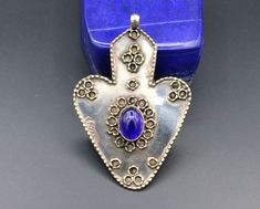 I am offering You Vintage Kazakh traditional carved Asyk heart pendant. Its 100% hand crafted workmanship with Blue glass beads. Please do not hesitate to contact if you have any questions. Weight : 13.3 grams, Length : 2.8" ( 7cm ) Width : 1.8" ( 4.5cm ) Shipping & Estimated Delivery Time With Turkish Registered Post, Destination CountryStandard Shipping (business days) United States          15-20  Europe7-15 Asia15-25  Australia15-20 Brazil & South America Traditional Handmade Heart Jewelry, Traditional Handmade Heart-shaped Jewelry, Traditional Heart Charm Pendant Jewelry, Traditional Heart-shaped Jewelry With Heart Beads, Traditional Carved Blue Jewelry, Traditional Jewelry For Jewelry Making With Heart Beads, Traditional Handmade Heart Necklaces, Pendant Heart, Handmade Heart