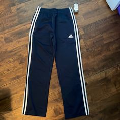 New With Tags Adidas Navy Blue Tricot Track Pants. Adidas Blue Sweatpants For Sports, Adidas Blue Sporty Sweatpants, Adidas Sporty Blue Sweatpants, Adidas Blue Cotton Pants, Navy Adidas Sporty Pants, Adidas Navy Sporty Pants, Adidas Sporty Navy Pants, Blue Cotton Pants With Three Stripes, Blue Adidas Cotton Sweatpants