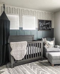 a baby's room decorated in gray and white