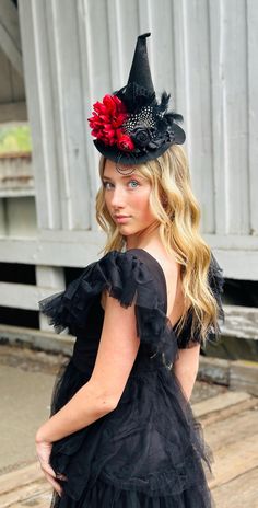 The perfect hat for Halloween!! Rich red and black colors and one of my favorite and most popular designs!  My daughter who's 15 loves to wear this one with the alligator clips attached under the brim so you can wear it centered or propped to the side.   Another popular way is our fabric lined u shaped flexible headband {one size fits most). This hat is sure to be a hit at parties!! Any questions please ask! Fun  black red witch  hat with rolled satin flower, bird cage netting and feathers. Has a band of ruffles around the base of the hat!     ♥ I do accept custom orders if I'm not too busy with orders, so if you see something in my shop but want it slightly different, just let me know! I have a lot of colors/styles, I just haven't posted them all. ♥o Red Witch Hat, Flower Witch, Witch Headband, Red Witch, Halloween Flowers, Flower Bird, Alligator Clips, Satin Flowers, Green Witch