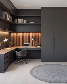 a modern home office with dark gray walls and wooden paneling, an area rug on the floor