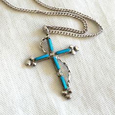 Vintage Turquoise Cross Necklace Southwestern 18 Inch Sterling Silver Western Jewelry Made from sterling silver and turquoise, this necklace makes a sweet southwestern statement. The cross measures 1 3/16" (3 cm) long. It is unmarked but is guaranteed to be sterling silver. It hangs from an 18 inch long 1 mm thick sterling silver cable chain that is marked 925 near the spring ring. The cross and chain weigh 3.25 grams combined. They are in excellent vintage condition and ready to wear. Is it a gift? Need to buy a card? All cards ship free with purchase. http://www.etsy.com/shop/AdobeHouseVintage?section_id=13802190 Thanks so much for looking! Cross Necklace Vintage, Turquoise Cross Necklace, Turquoise Cross, Western Jewelry, Vintage Turquoise, Necklace Vintage, Cable Chain, Spring Rings, Vintage Necklace