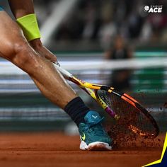 a tennis player is hitting the ball with his racket