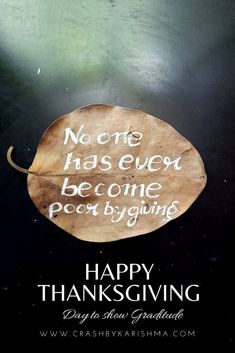 a leaf with the words happy thanksgiving written on it