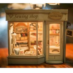 a miniature store with the front door open