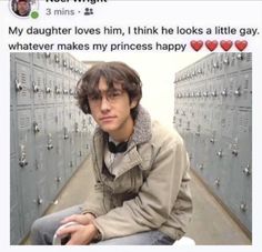 a young man sitting in front of lockers with hearts on them